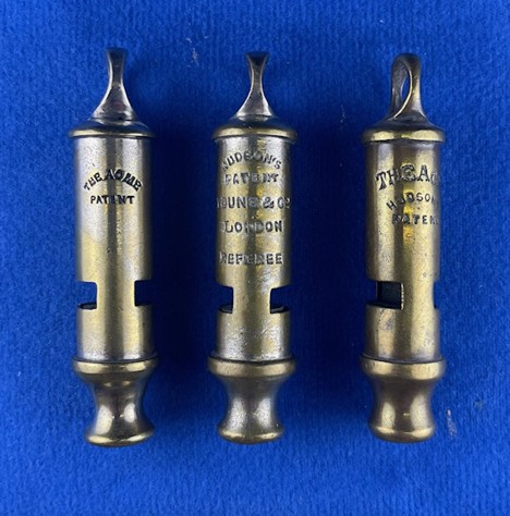 acme whistle group photo showing Model 048 construction details and two-window tubular design
