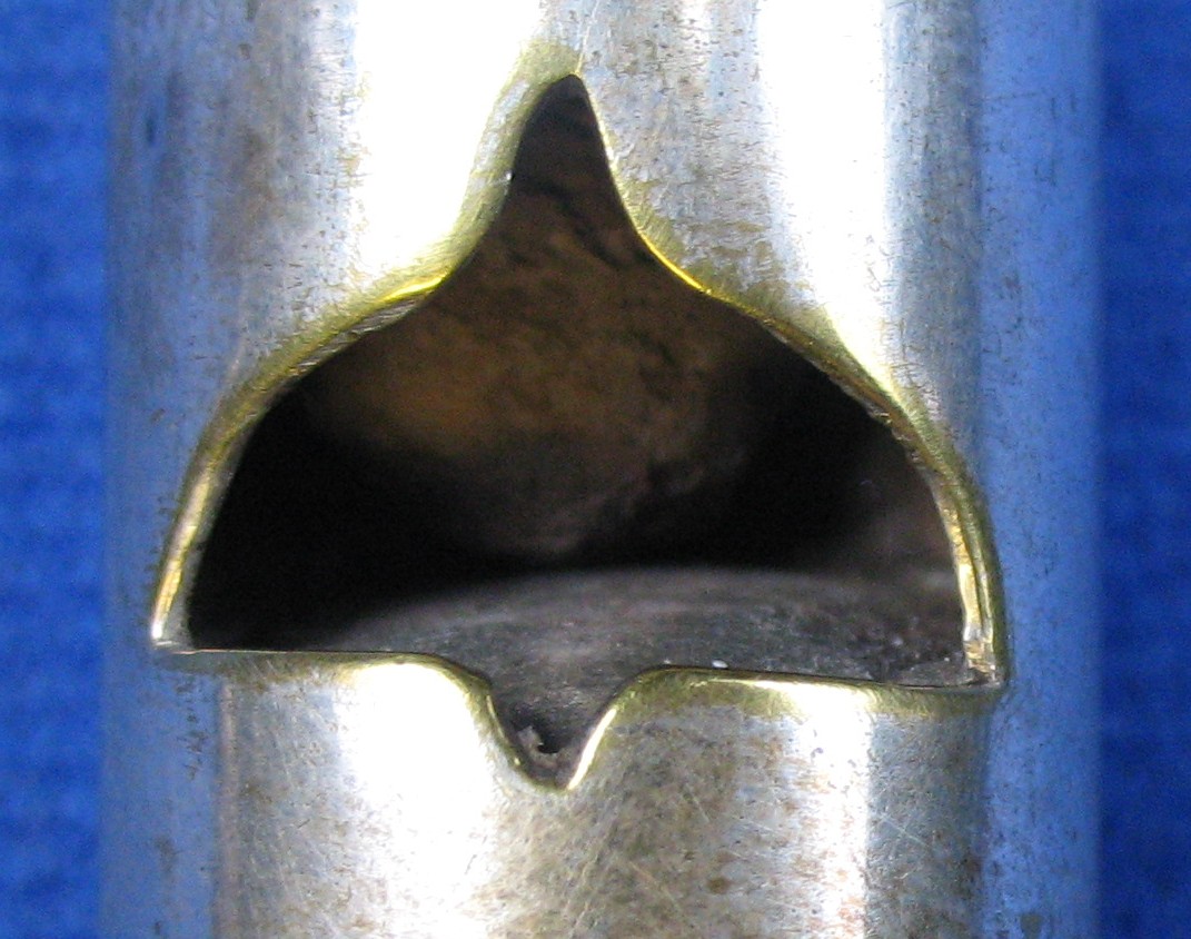 barrall round whistle ornate window opening, sweeping arched points
